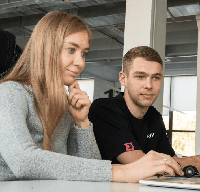 Girls smiling while seeing their laptop screens