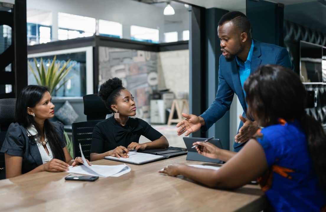 Boss explaining to team members